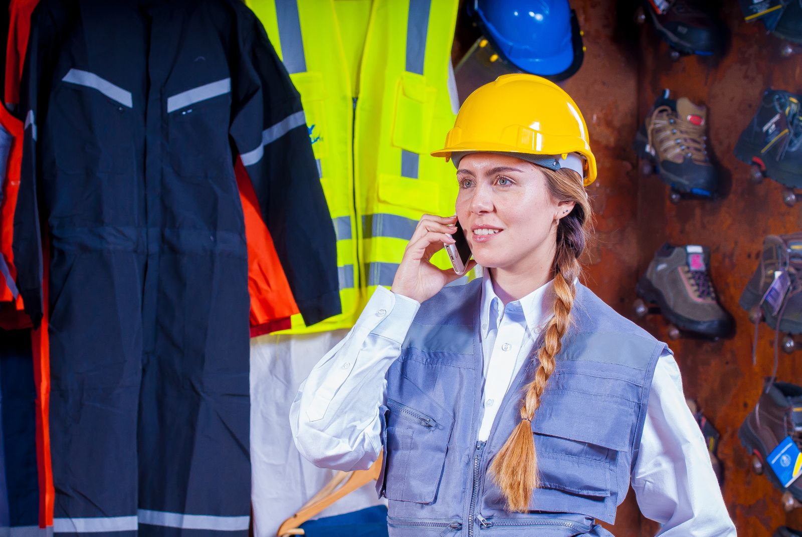 Manufacturing engineer in a hard hat on the phone to Fitfactory support